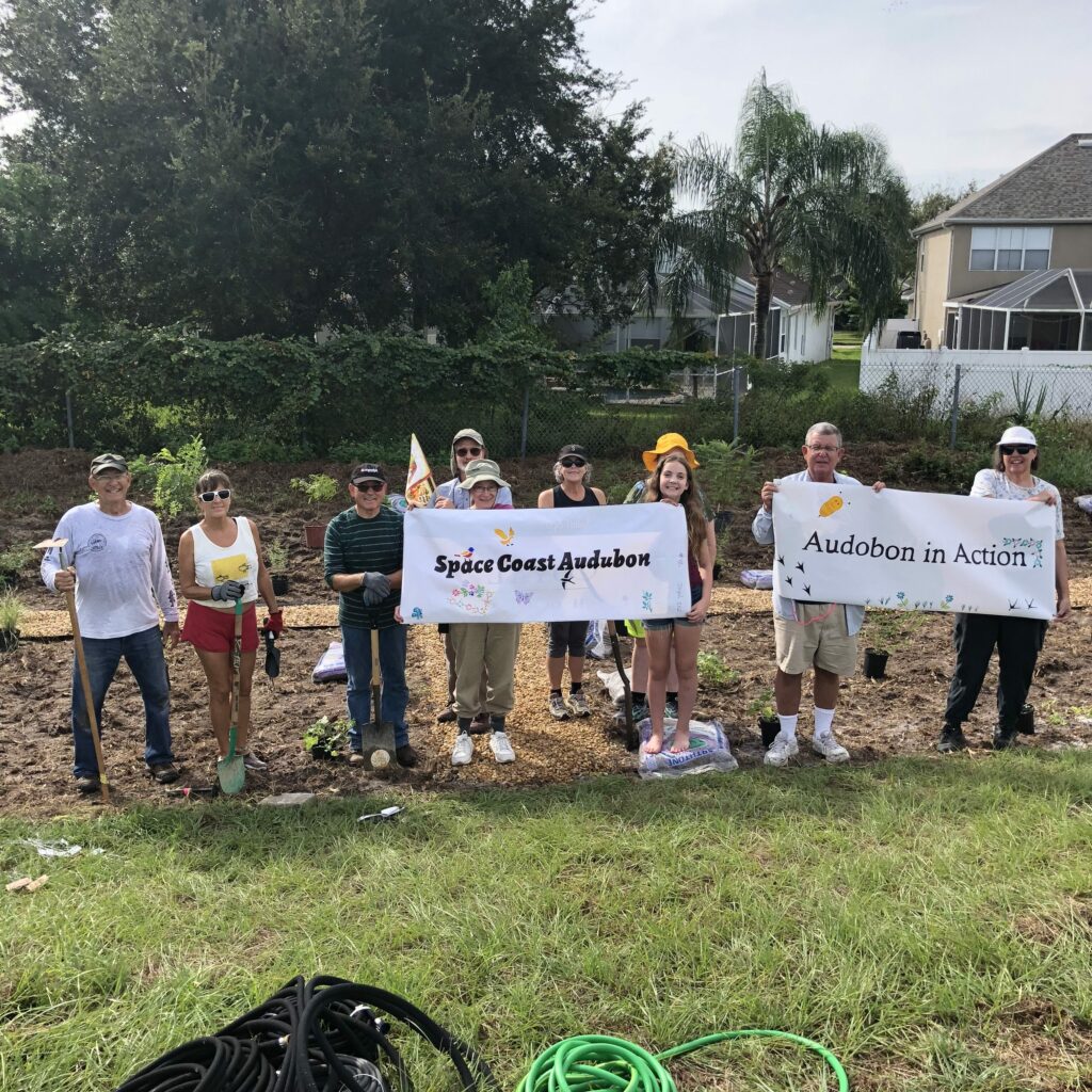 Displaying the Signs at the Garden Planting Event