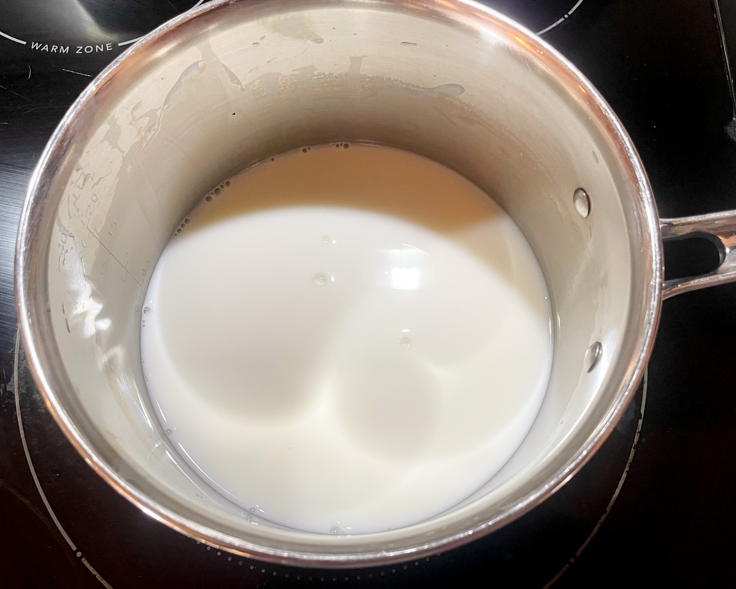 Asiago Grits Step 1 - heat milk and water on the stove