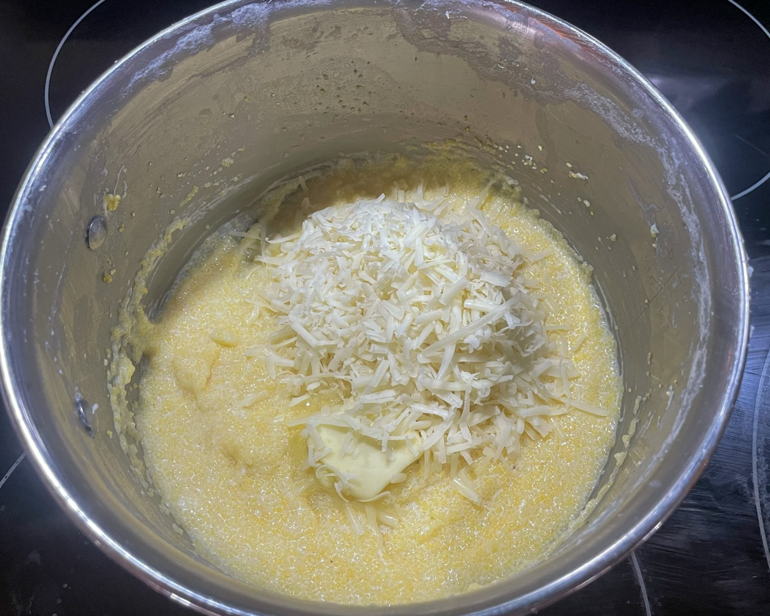 Asiago Grits Step 3 - add butter, cheese, and any spices, and stir to combine.