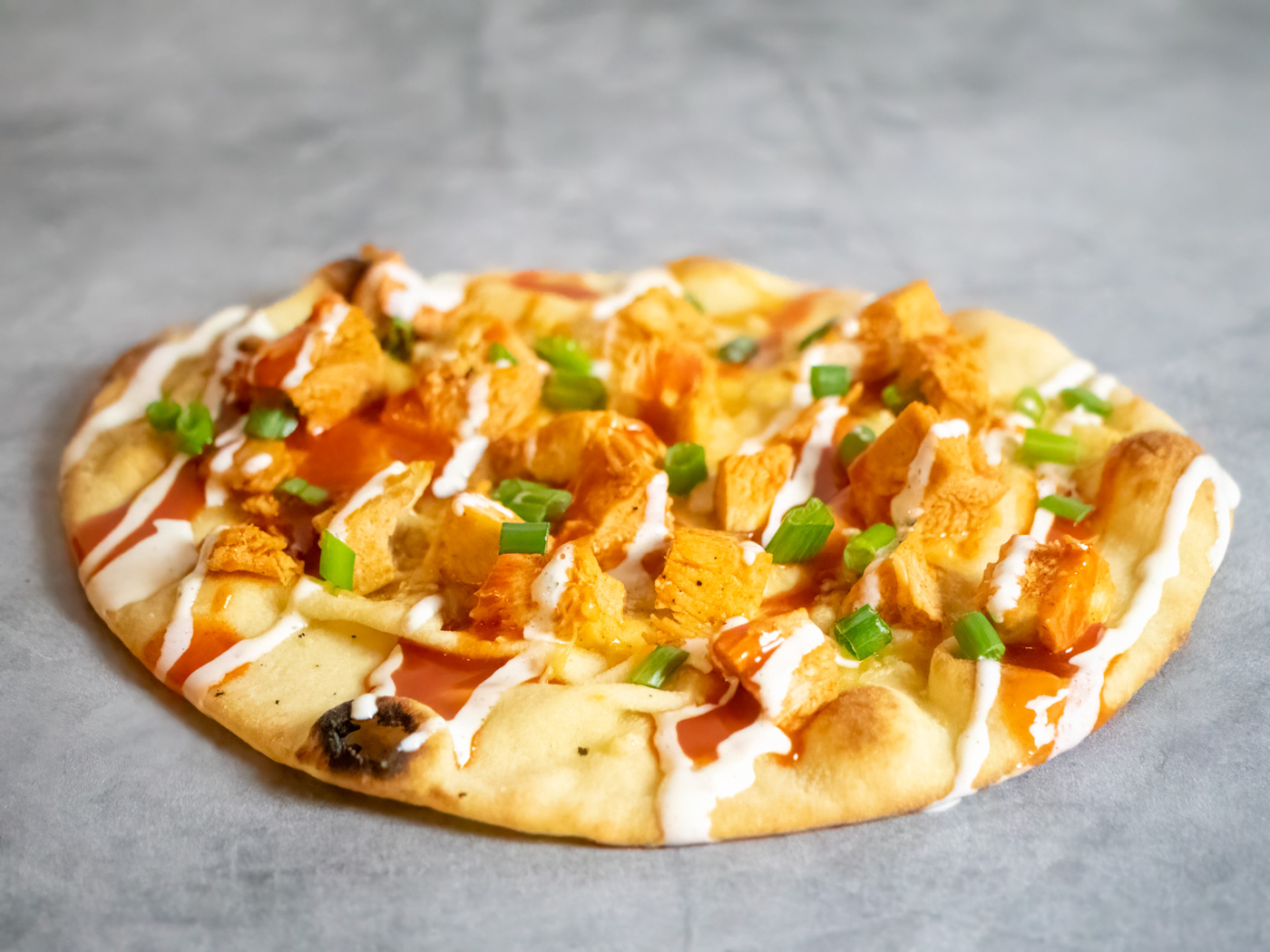 This buffalo chicken flatbread pizza combines all the wing flavors you love, but in a hand-held format that's much less messy!