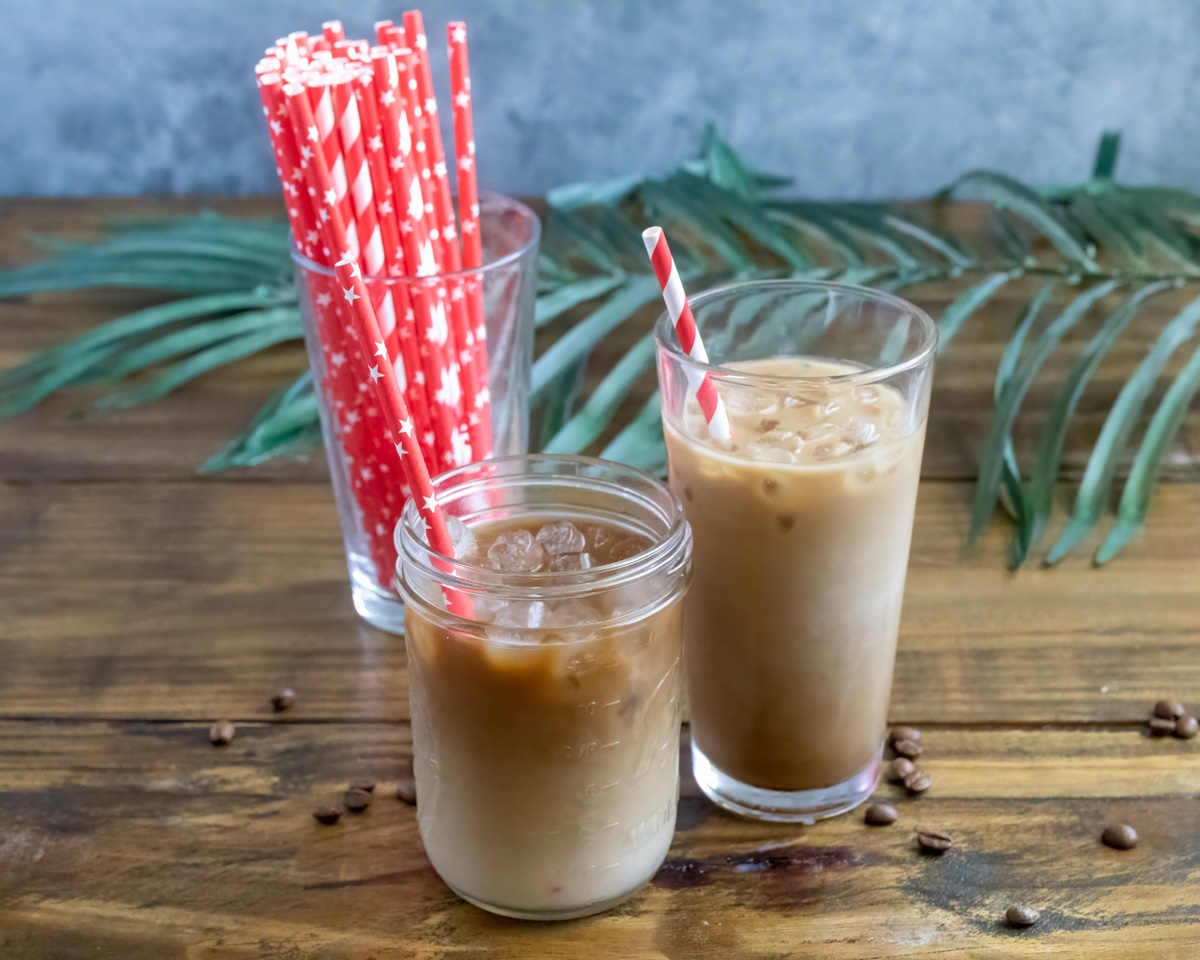 Two glasses of Chick-fil-A Iced Coffee with red straws