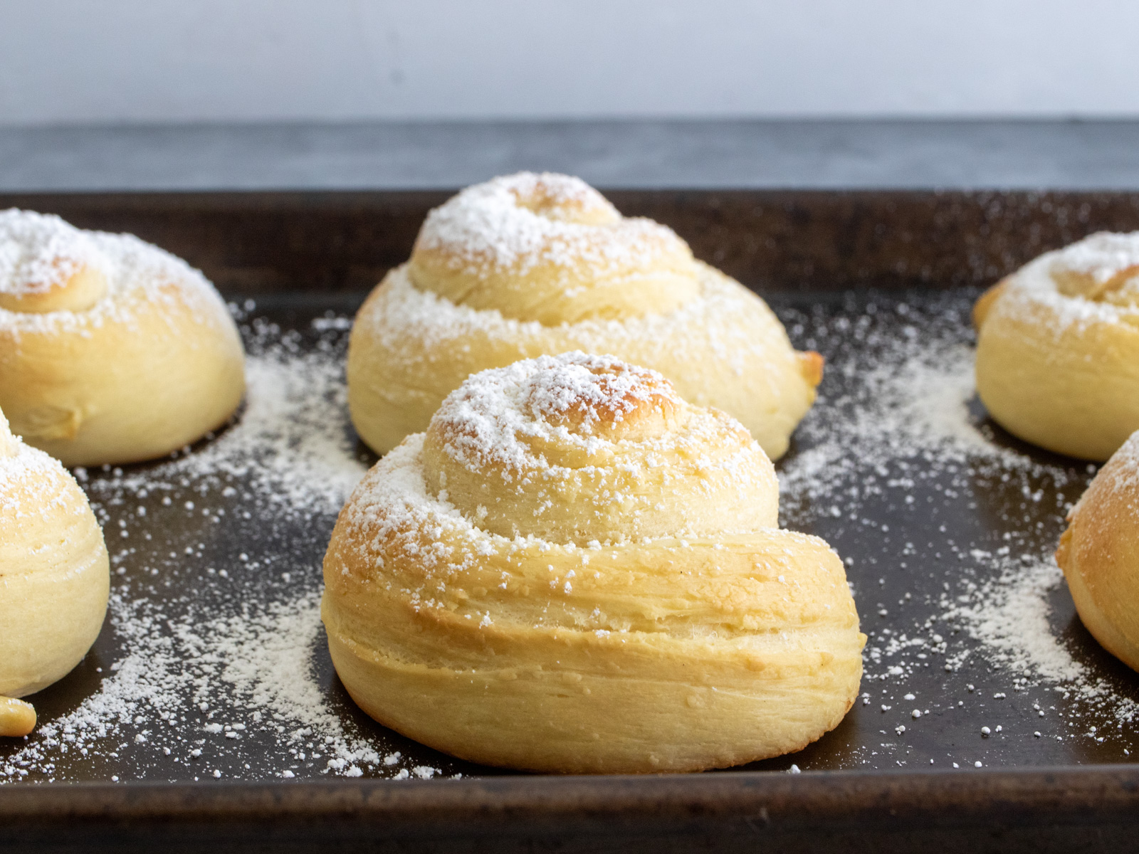 Close-up of pan de mallorca pastries dusted in sugar