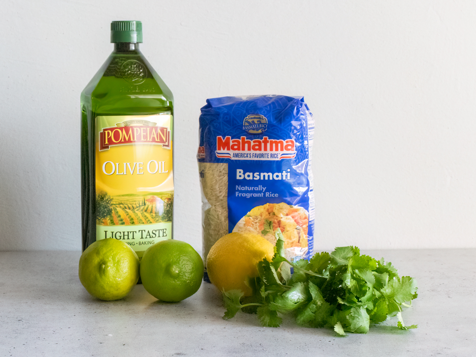 Ingredients: Bottle of olive oil, bag of basmati rice, fresh limes and lemons and some cilantro sprigs