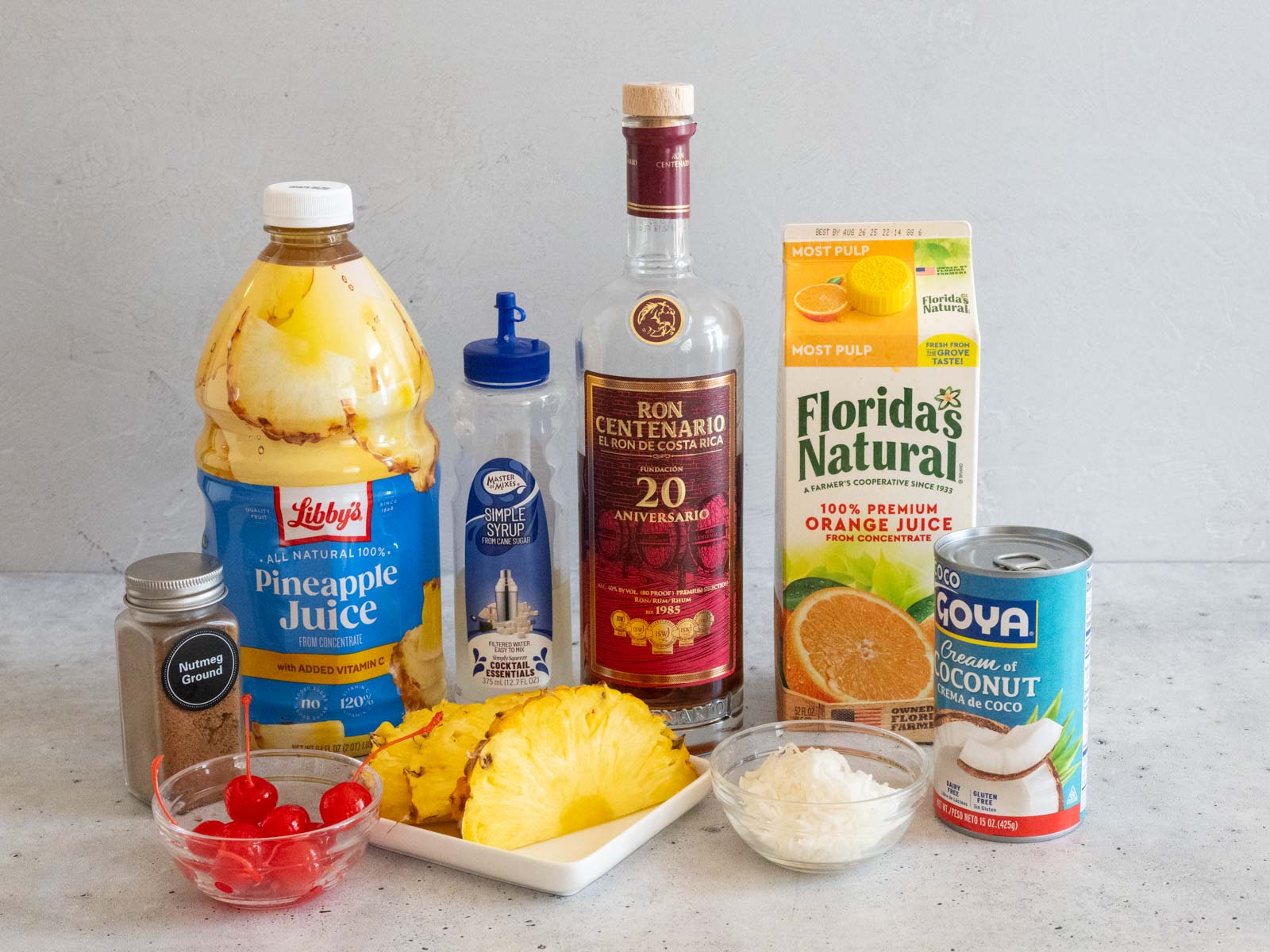 Ingredients to make a Painkiller cocktail