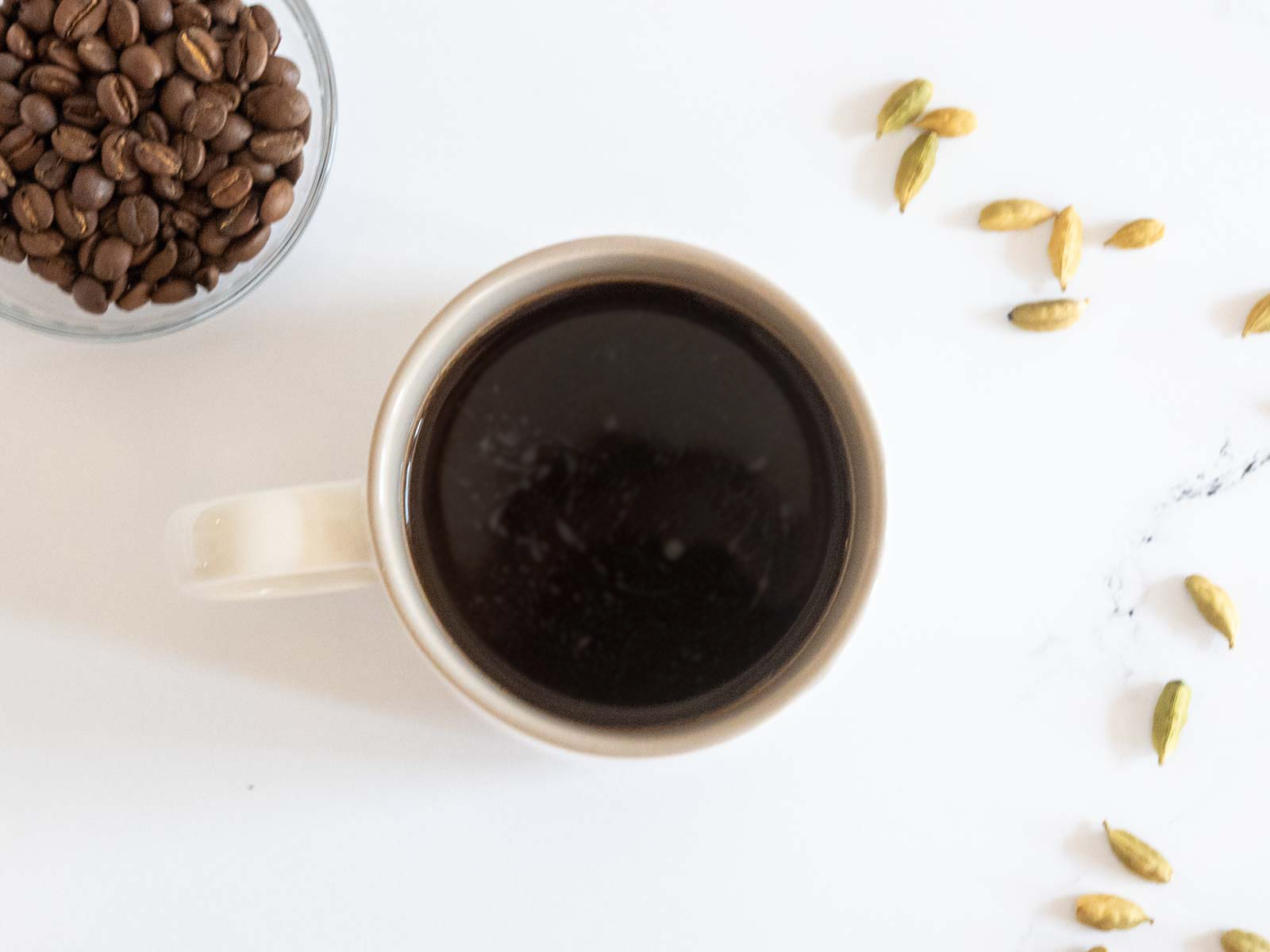 Overhead shot of cardamom coffee in a mug
